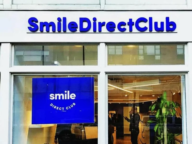 SmileDirectClub lettering above a glazed entrance
