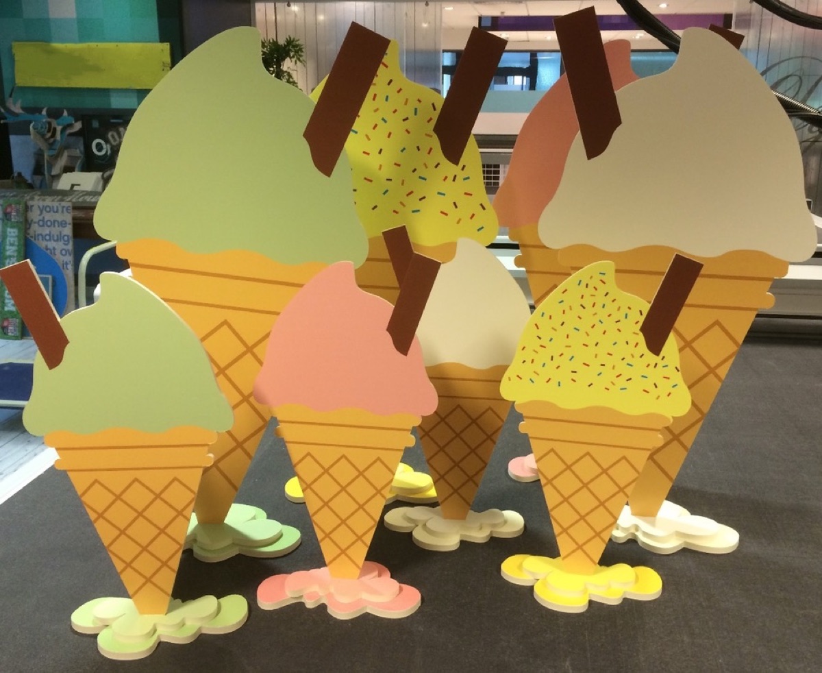 Printed ice-cream cone cut-out displays standing on routed bases for a retail promotion