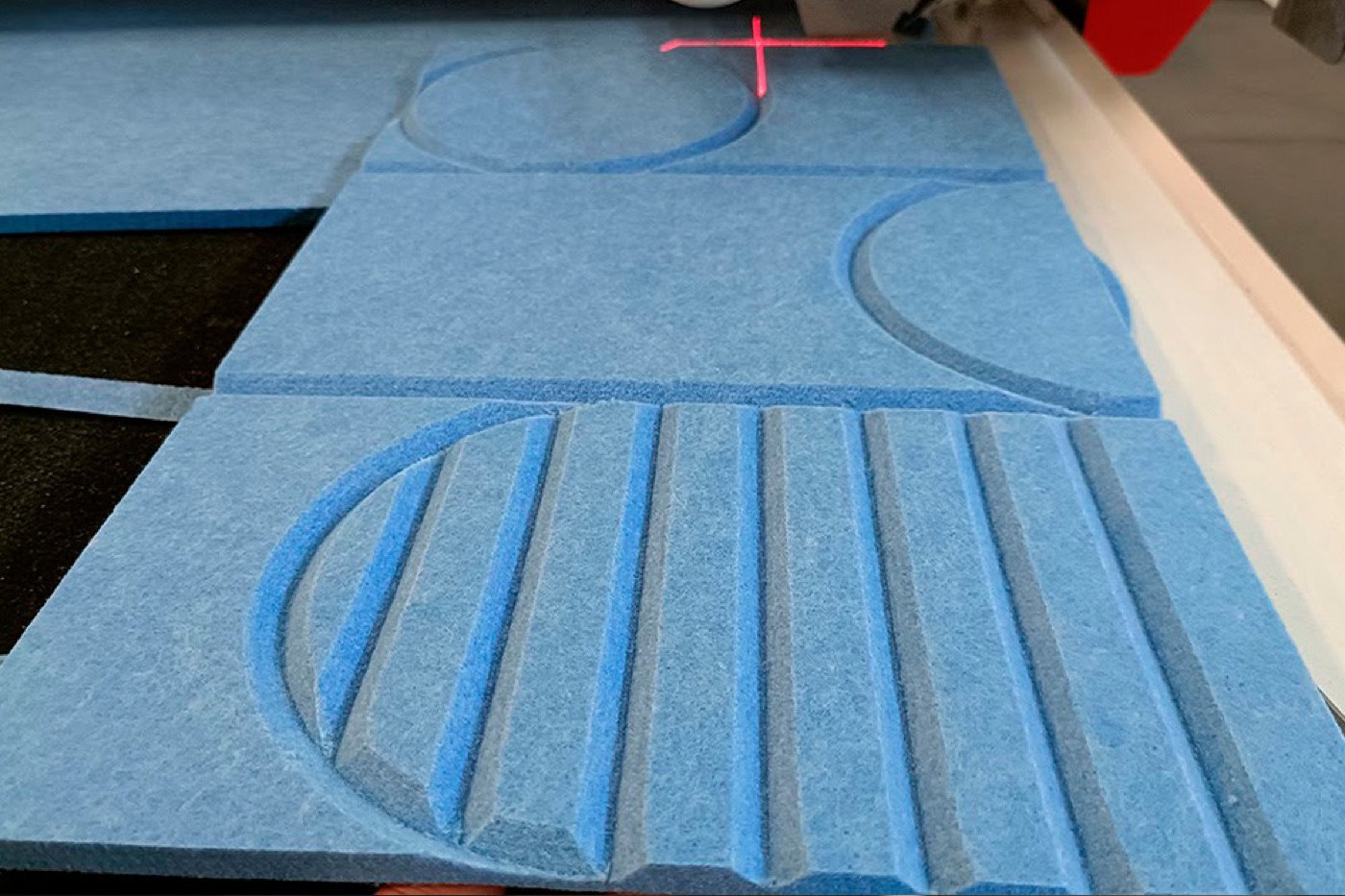 Acoustic felt cut into a repeating pattern on the flatbed knife cutter