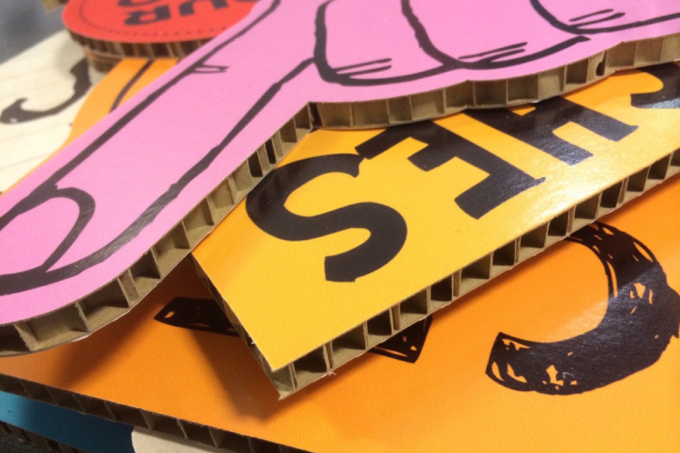 Printed corrugated display parts contour-cut to shape
