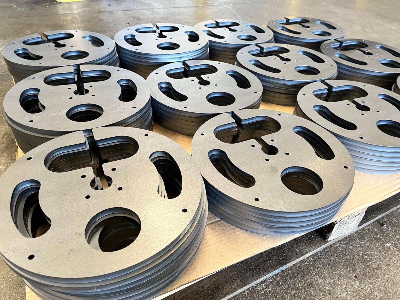 Mild steel cutouts nested and cut from sheet
