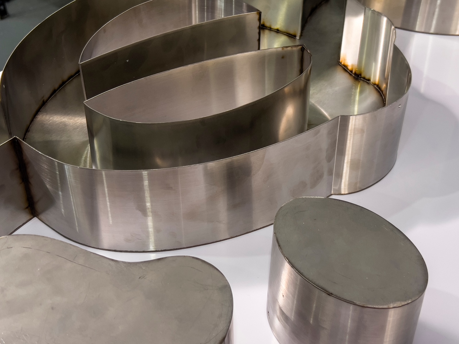 Stainless fabricated letters after cutting and welding
