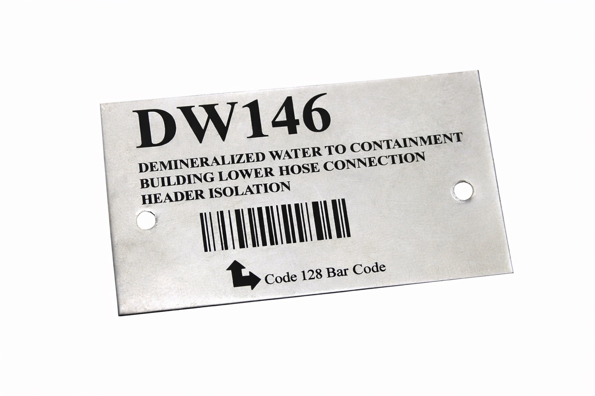 Stainless isolation tag marked with text and Code 128 barcode