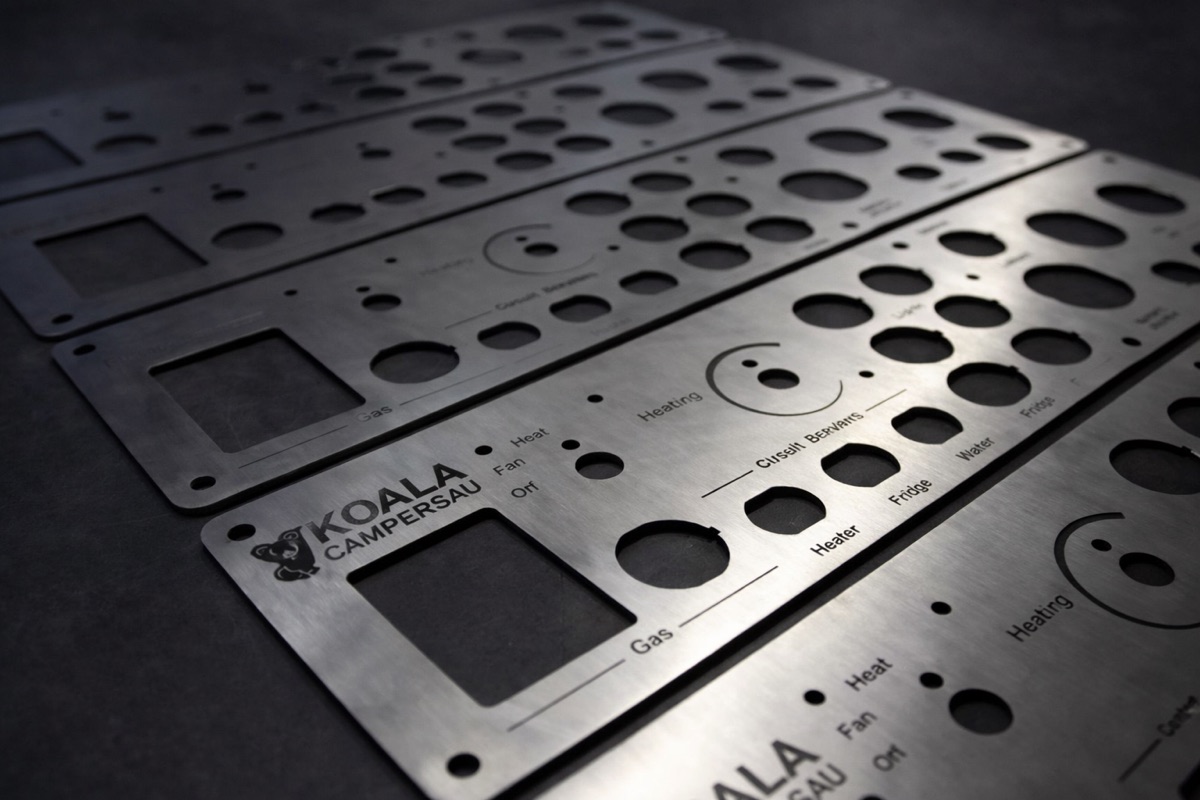 Stainless control panels laser marked with switch legends and brand logo