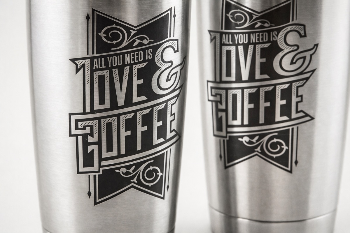 Stainless tumblers with laser-etched decorative branding