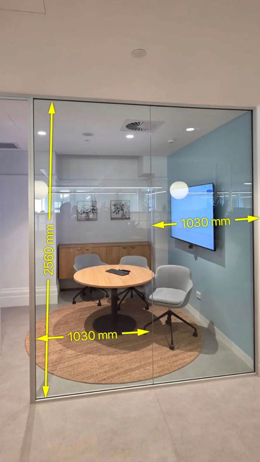 Survey photograph of the clear glazed meeting room marked up with the pane sizes, two thousand five hundred and sixty millimetres high by one thousand and thirty millimetres wide per pane