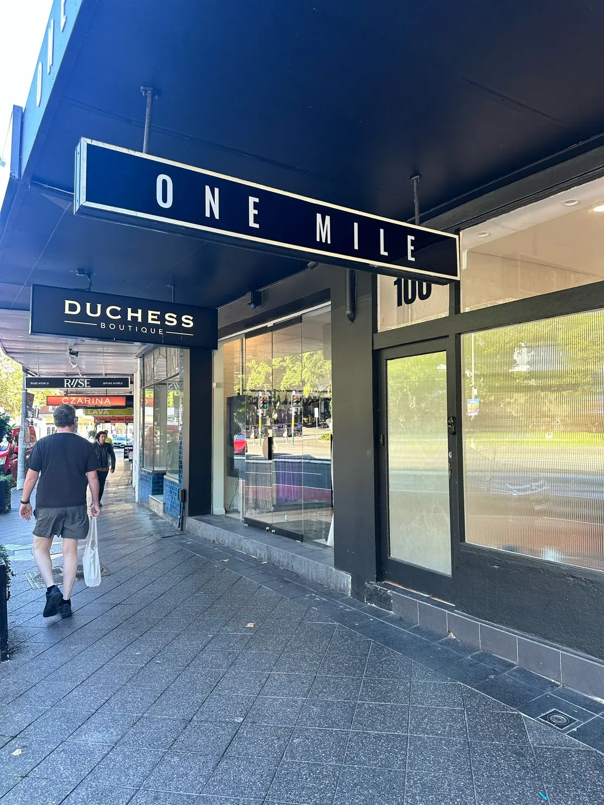 ONE MILE illuminated projecting lightbox installed beneath the awning of the Paddington boutique in Sydney