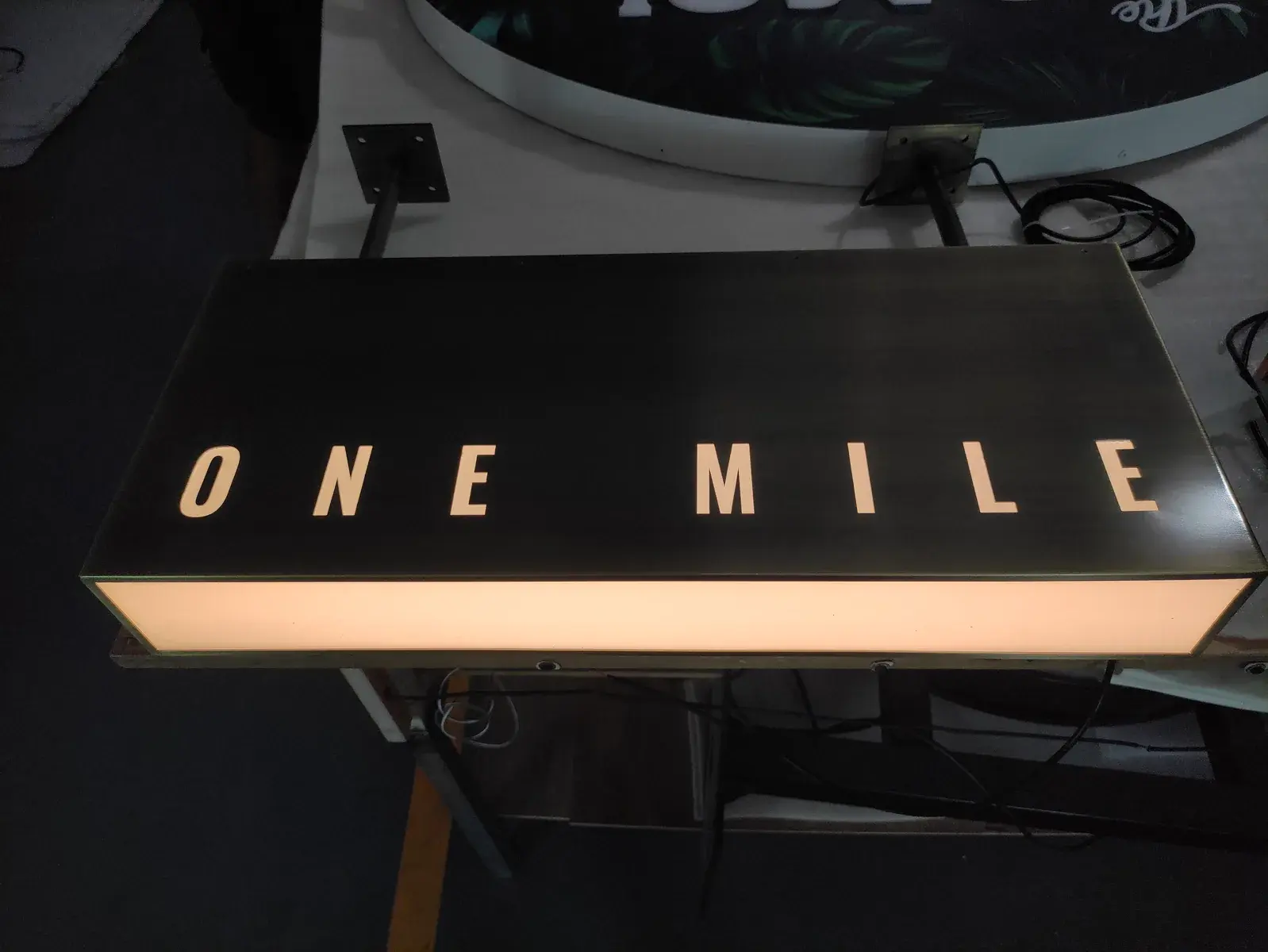 ONE MILE projecting lightbox illuminated during workshop quality control before site installation