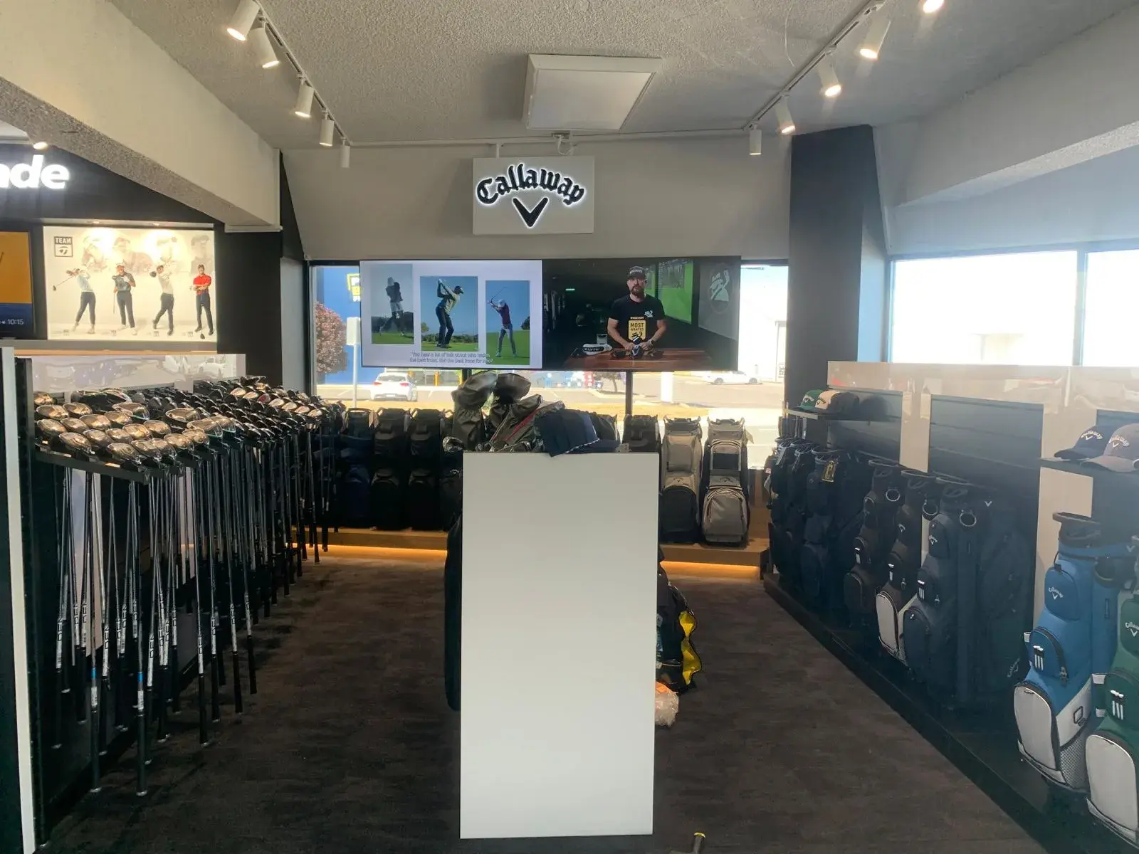 Callaway department signage above the club racks and demonstration area on the sales floor