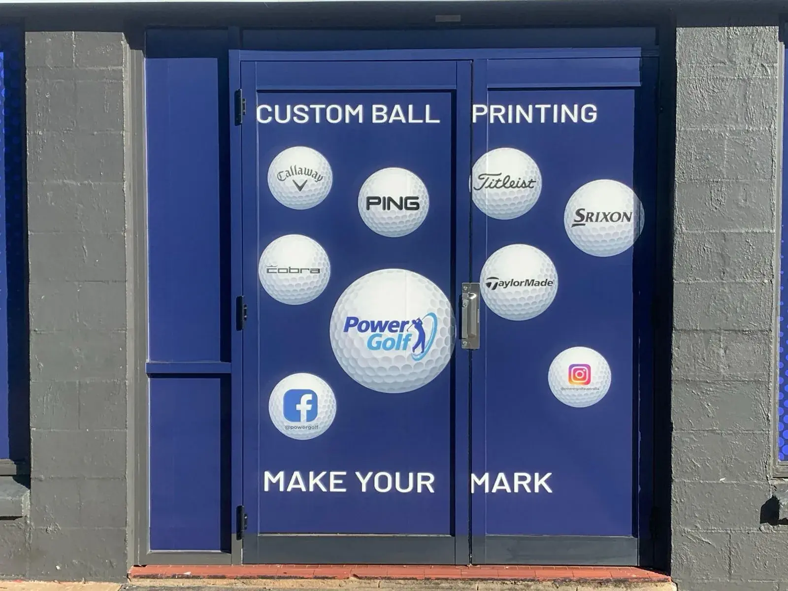 Custom ball printing entry doors finished with printed golf ball brand graphics