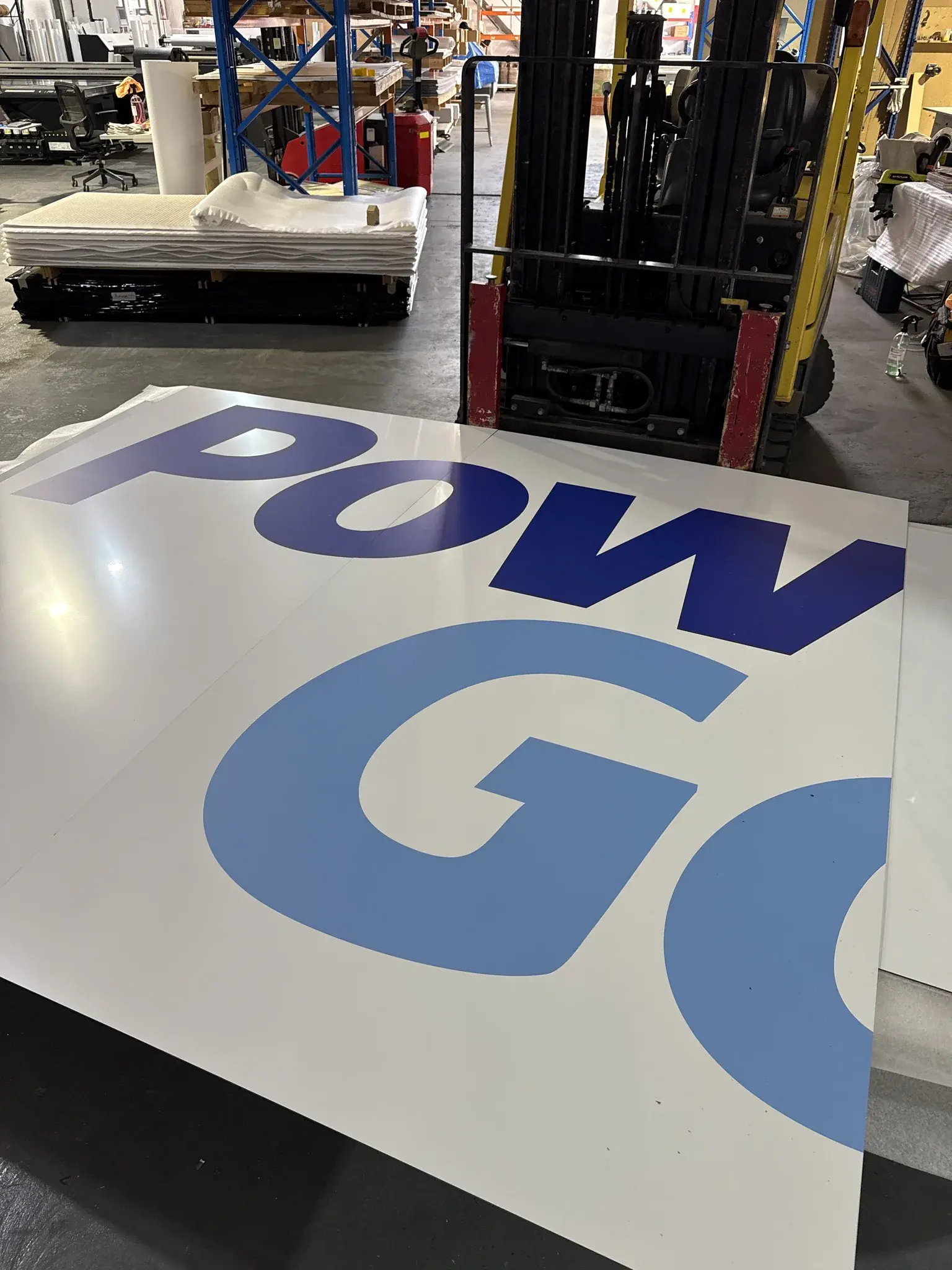 Large Power Golf fascia sign panel prepared for delivery in the production workshop