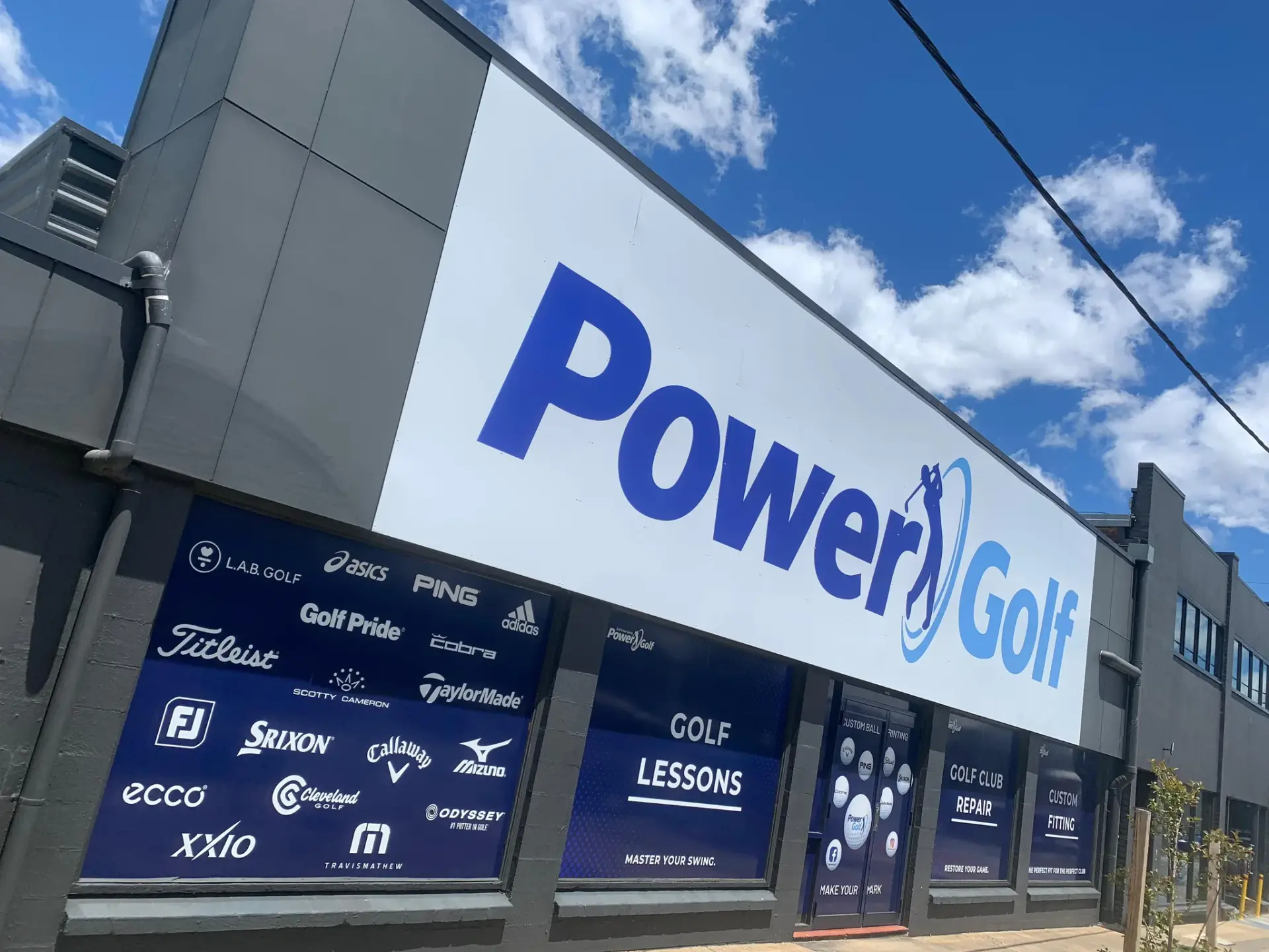 Completed Power Golf shopfront fascia sign above branded window graphics at the Fyshwick superstore