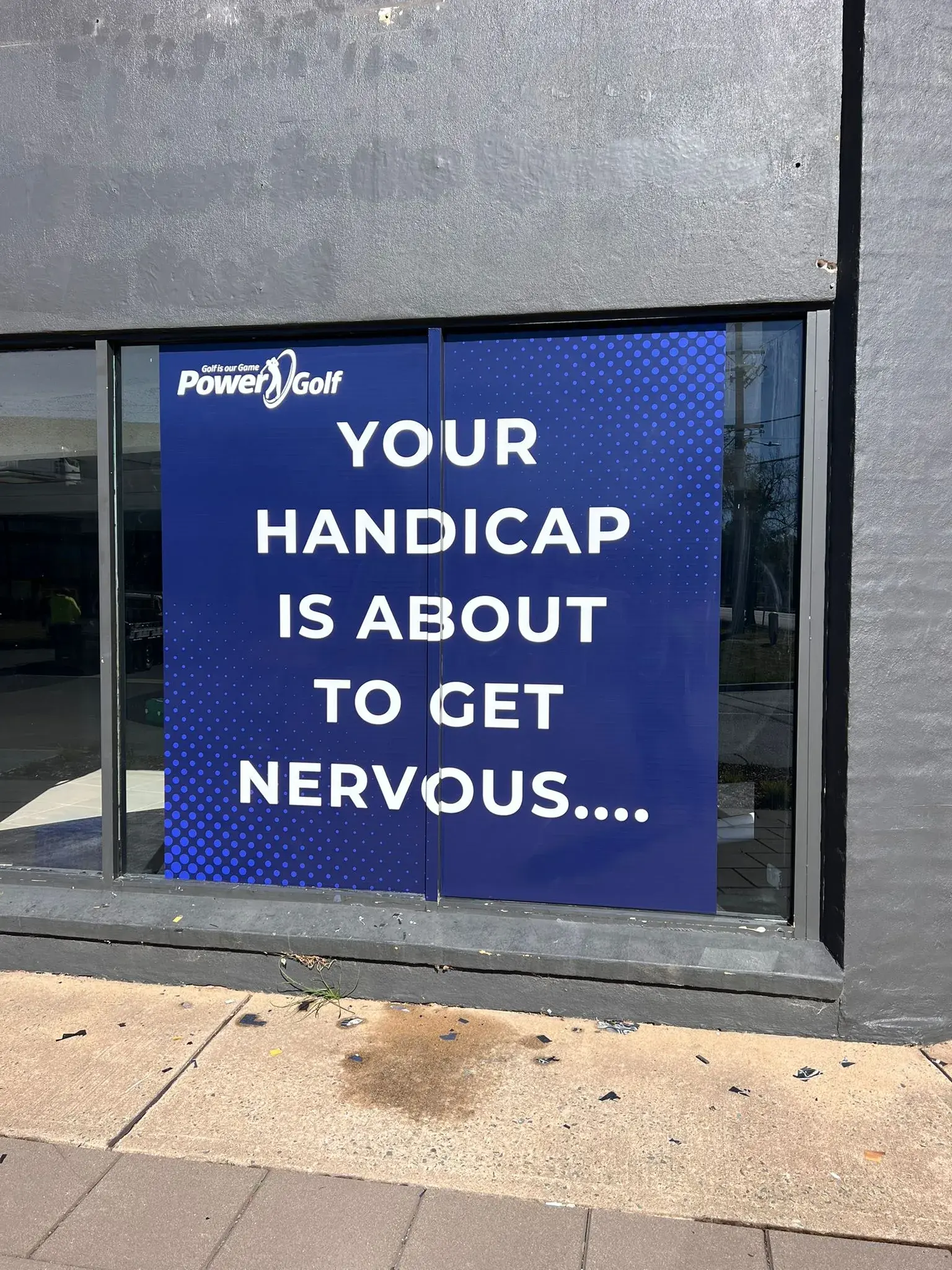 Pre-opening Power Golf teaser window graphic installed before the store launch