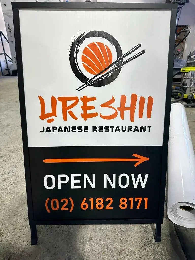 Completed Ureshii Japanese Restaurant A-frame sign with an Open Now message and directional arrow