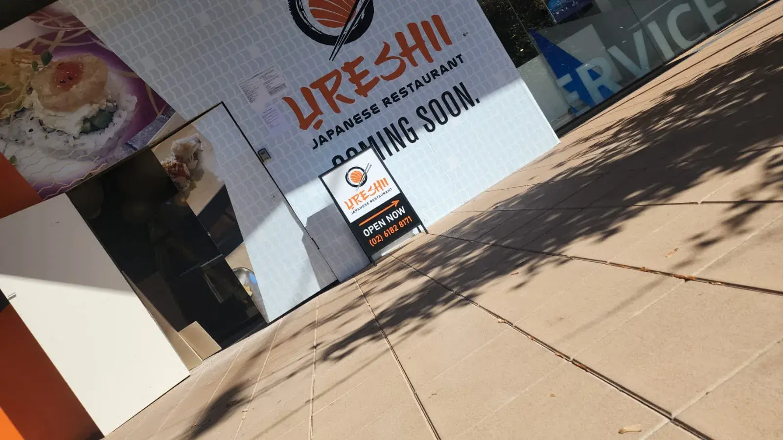 Ureshii restaurant opening graphics installed across the Greenway shopfront glazing
