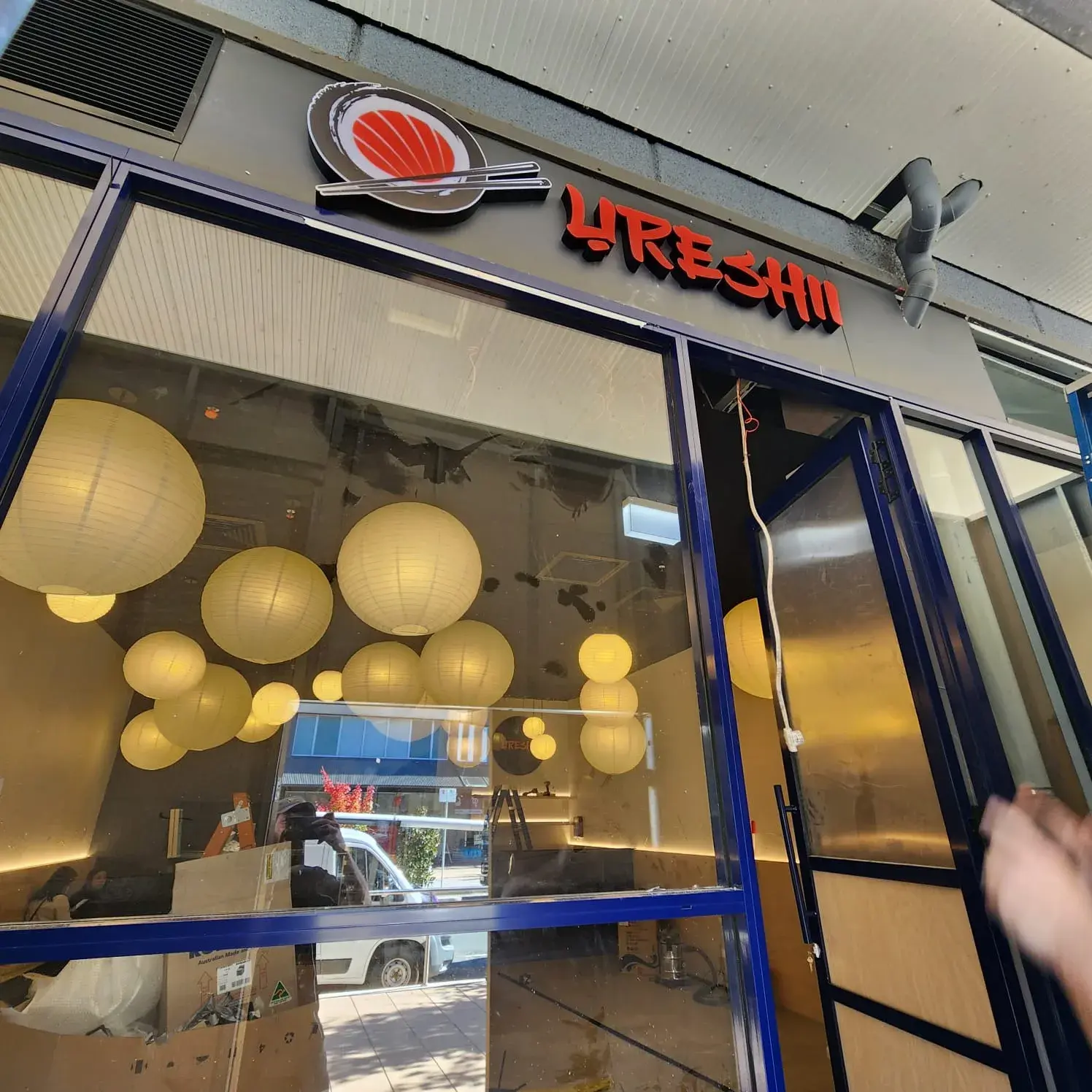 Wider view of the Ureshii Japanese Restaurant shopfront signage during the Greenway installation