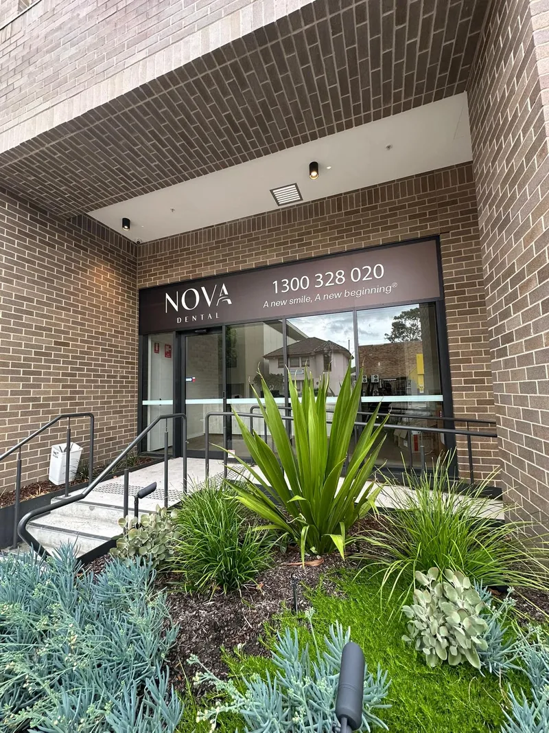 Nova Dental lettering and branded glass beside the clinic entrance.