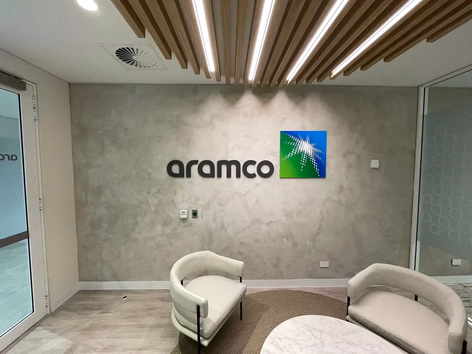 Painted metal Aramco lettering on a reception wall in Sydney CBD