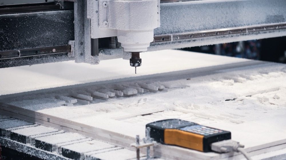 CNC router cutting a composite panel