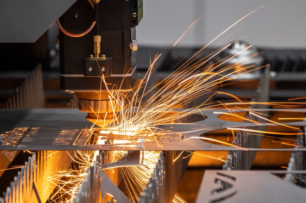 Fiber laser cutting sheet metal with a bright cutting spark